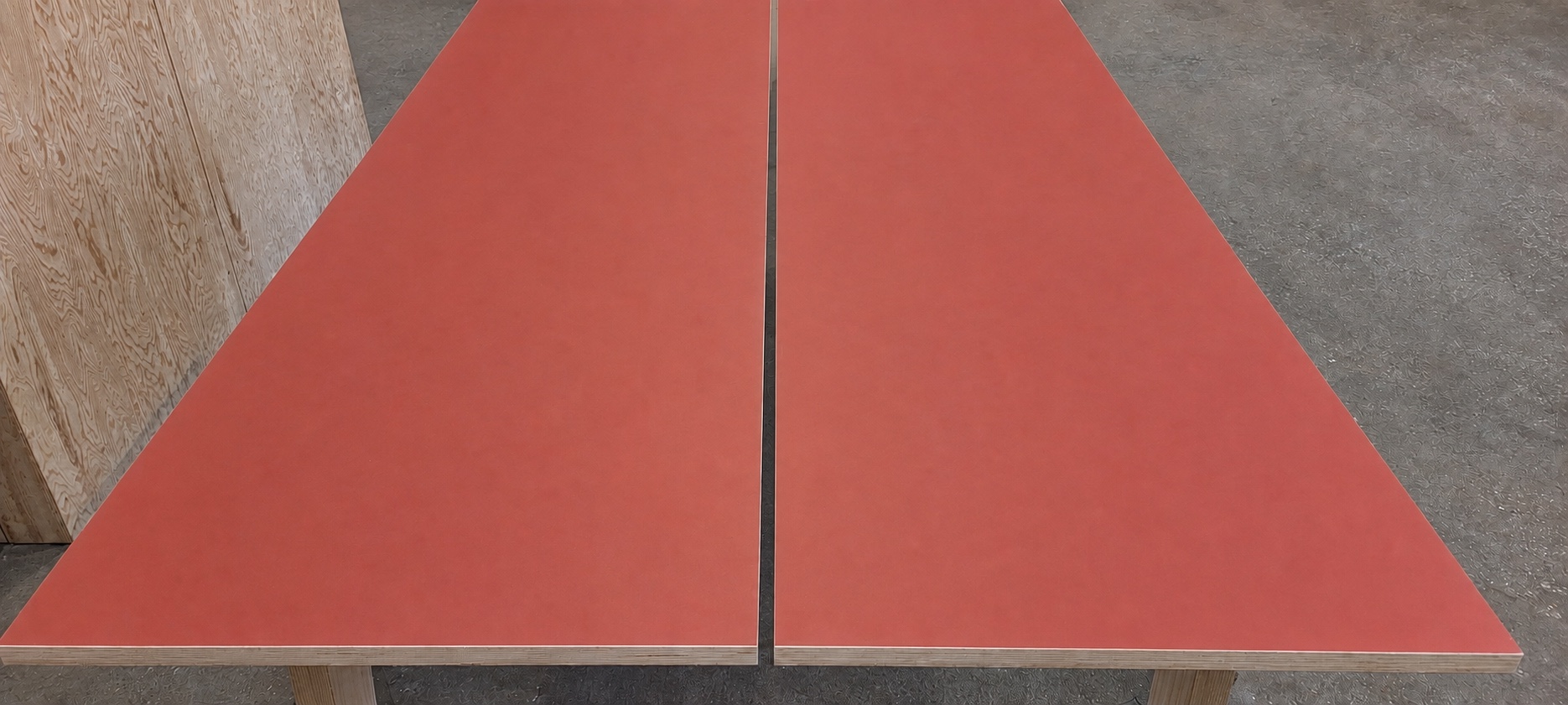 Color-corrected paired red Marmoleum surfaces meeting along a narrow reveal