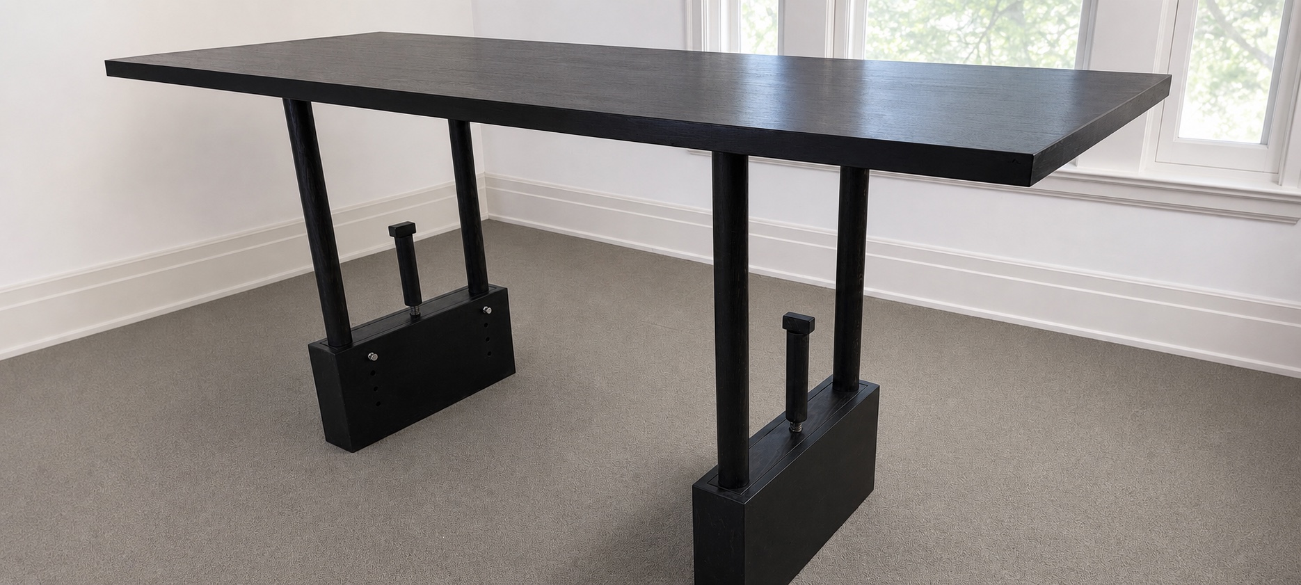 Black TableRaise kinetic table showing the full adjustment mechanism